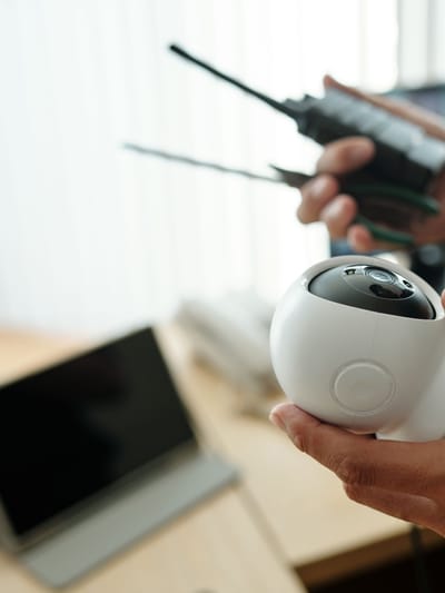 off grid security camera rv in the hands of a boondocker setting up his remote system